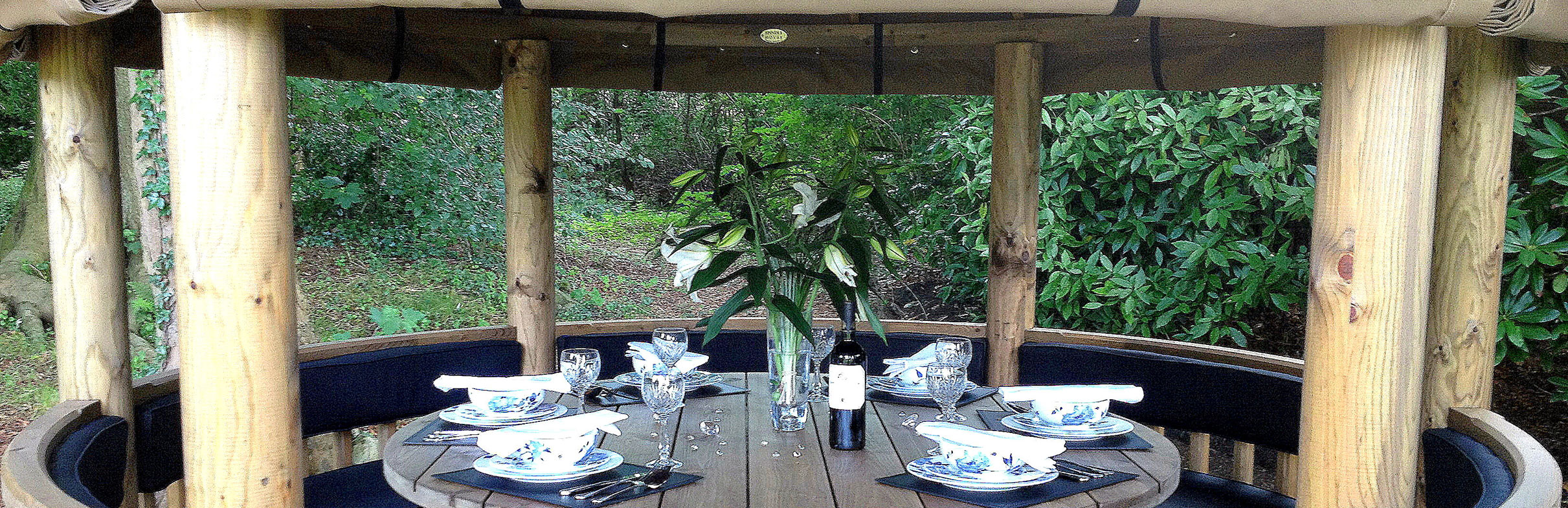 Close up of 3 metre gazebo inside with table set for dinner