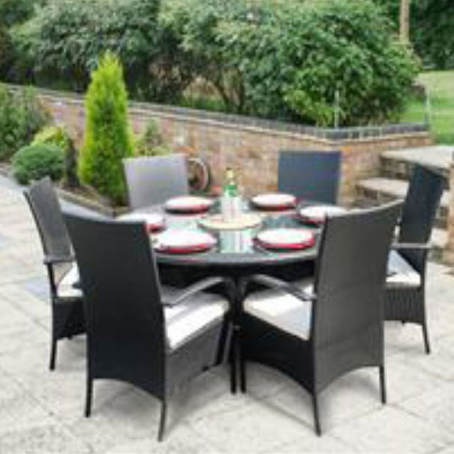 Black rattan table with 6 chairs on patio