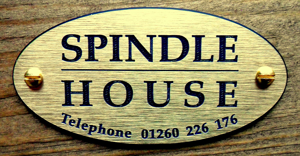 Close up of Spindle House sign with phone number